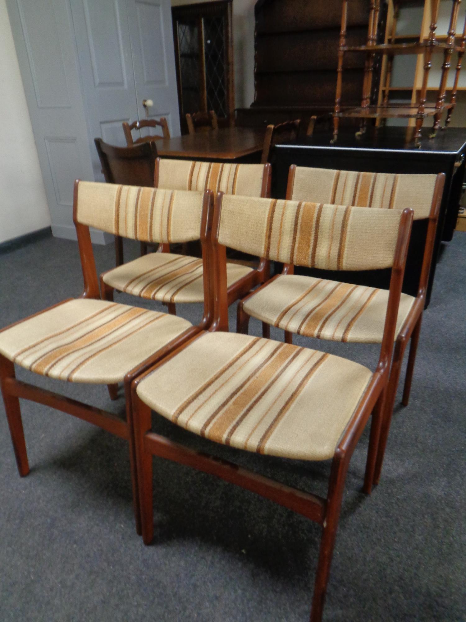 A set of four mid 20th century Danish teak dining chairs