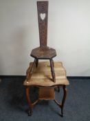 A shaped Edwardian two tier occasional table together with a carved oak spinning chair