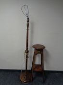 An Edwardian oak plant stand together with a beech standard lamp