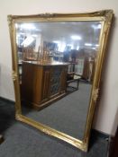 A Victorian style gilt framed bevel edged overmantel mirror
