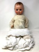 An Armand Marseille bisque-headed jointed doll stamped AM Germany,