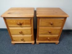 A pair of pine three drawer bedside chests