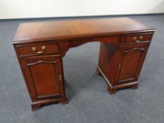 A Regency style inlaid twin pedestal desk fitted two drawers