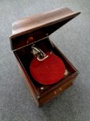 An antique HMV table top Grafonola together with a box containing 78s
