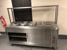 A stainless steel bain marie counter with hot cupboard base, width 190 cm.