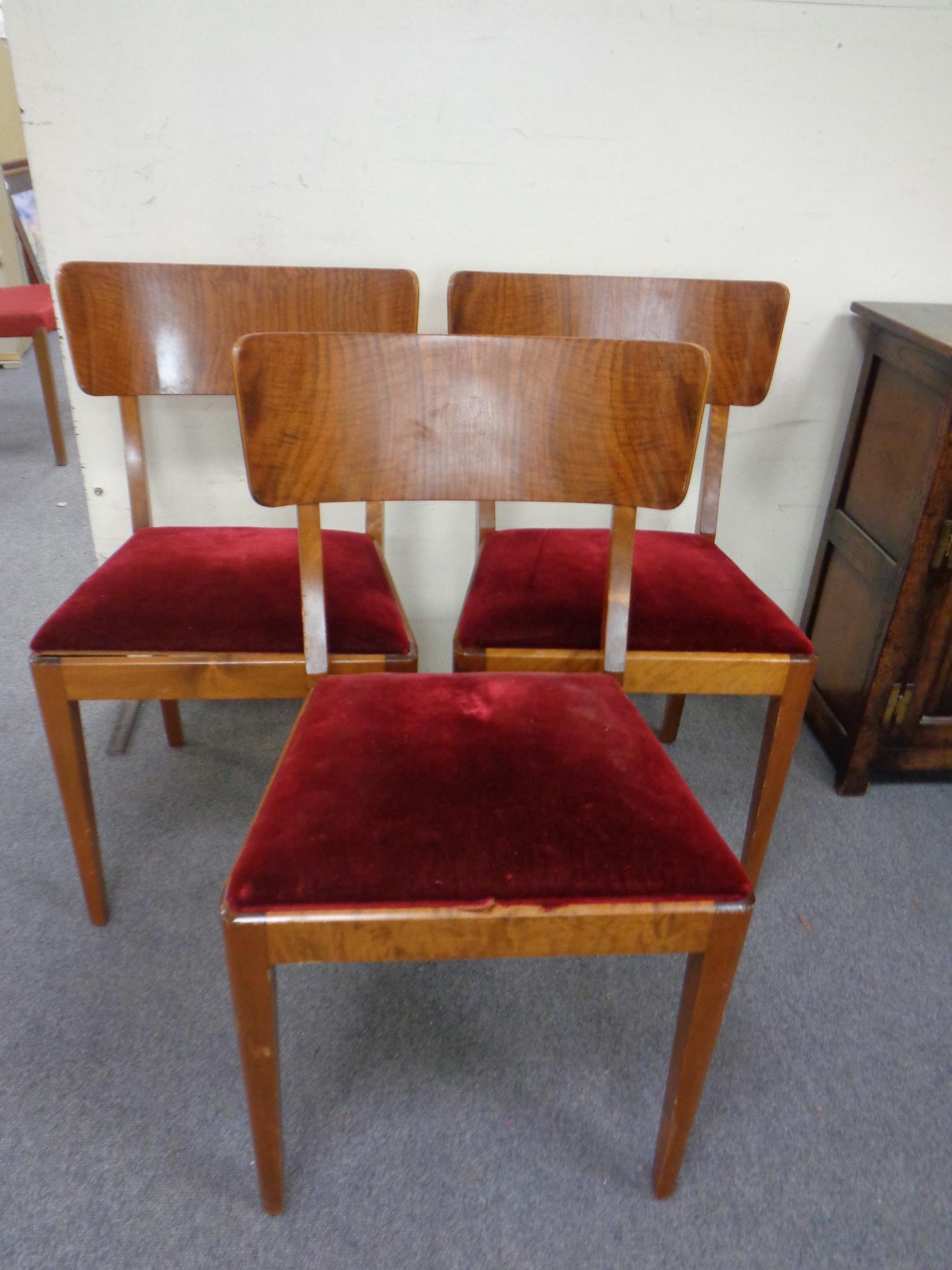 A set of three 20th century teak chairs