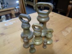 A set of seven 19th century brass graduated weights