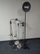 Six assorted continental floor and angle poise lamps