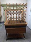 A hostess trolley together with a metal and pine wine rack