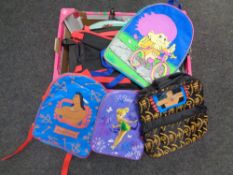 A box of children's back packs and witches hats
