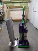 A Dyson DC03 upright vacuum with accessories together with a Rownenta tower fan