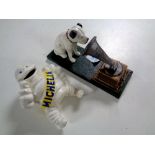 A cast iron figure - Michelin man together with a further cast iron HMV figure - Nipper the dog