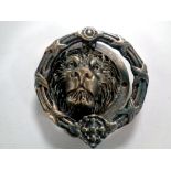 A cast iron Lion's head door knocker