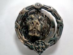 A cast iron Lion's head door knocker