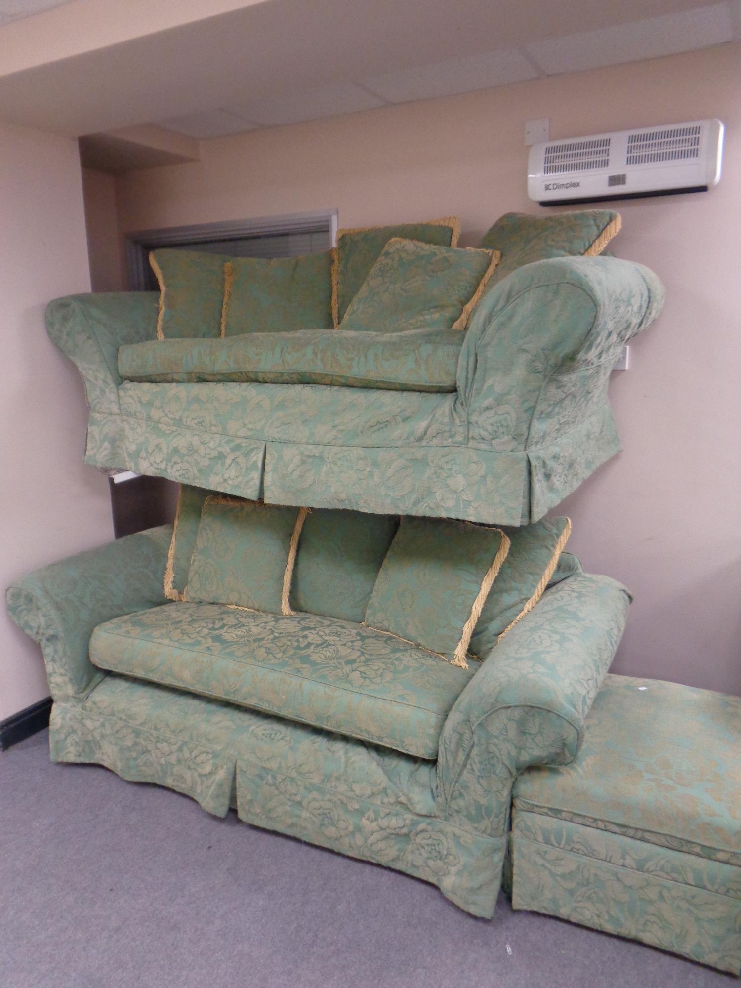 A traditional style three and two seater settees plus matching footstool