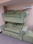 A traditional style three and two seater settees plus matching footstool