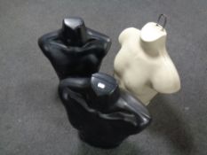 Three plastic male mannequin torsos