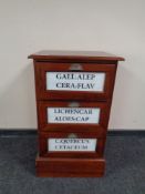 A reproduction three drawer chest with advertising decoration
