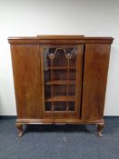 An early 20th century mahogany bookcase fitted with three doors