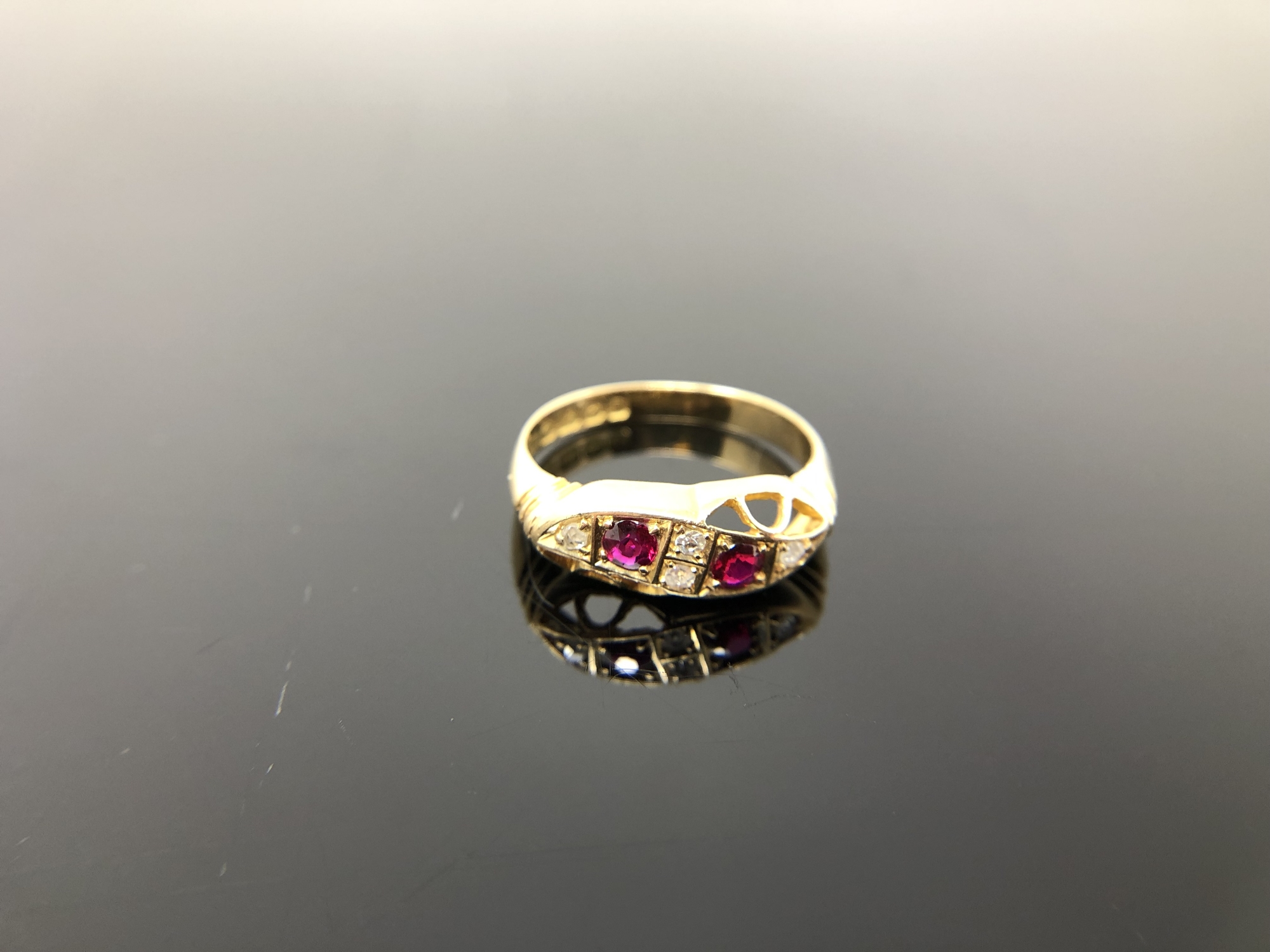 An antique 18ct gold ruby and diamond ring, size N CONDITION REPORT: 2.