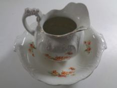 A Victorian Burslem floral patterned wash jug and basin