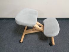 A kneeling chair on casters