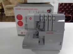 A Singer heavy duty 14 HD 854 over locking sewing machine,