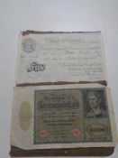 A 1952 Bank of England five pound note together with a 1922 German 10,