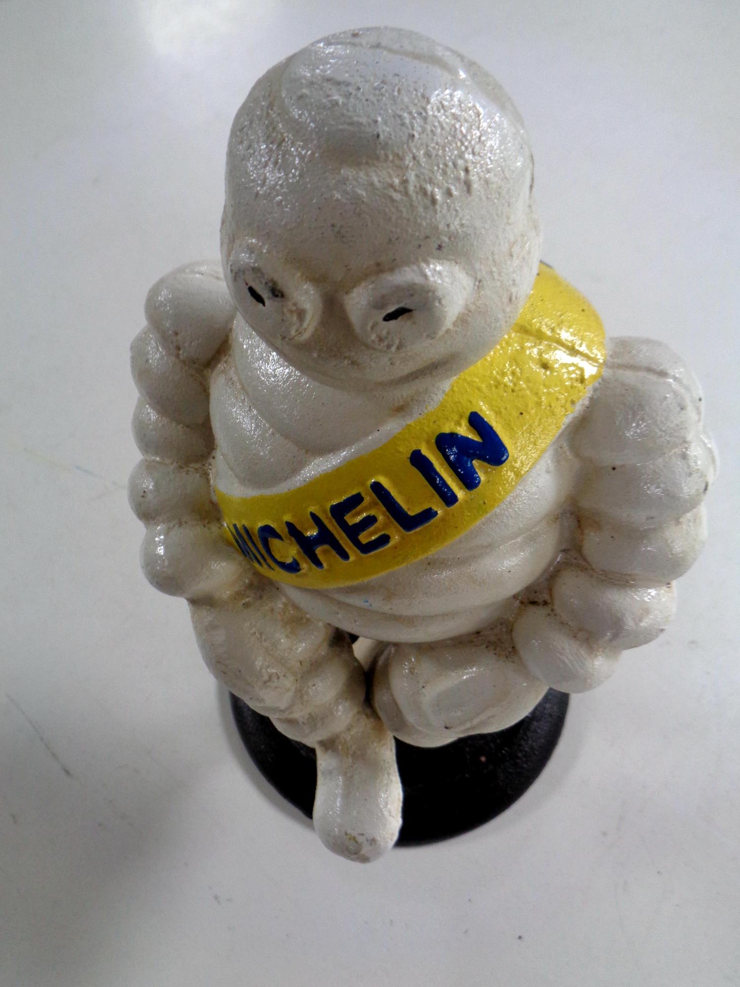 A cast iron figure - Seated Michelin man