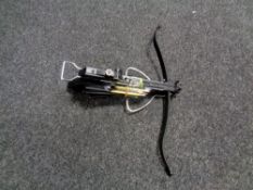 A mini crossbow with bolts