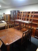 An Edwardian mahogany wind out table fitted a leaf (no handle) together with a set of six chairs