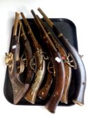 A tray of seven ornamental pistols