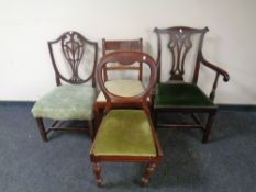 A 19th century mahogany Hepplewhite style armchair together with three further antique dining