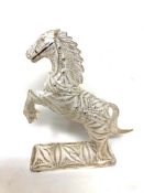 A silver filigree horse figure,