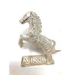 A silver filigree horse figure,