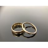 A 9ct gold band ring (shank split), together with an 18ct gold ring.