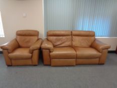 A good quality tan leather reclining two seater settee and matching armchair