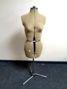 An adjustable dress makers dummy on stand