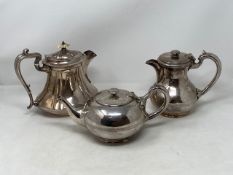 Three early twentieth century silver plated hot water jugs