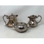 Three early twentieth century silver plated hot water jugs