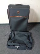 A Pierre luggage case on wheels together with a suit bag