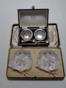 A pair of cut glass salts with spoons together with a further pair of cut glass dishes with silver