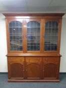A 19th century mahogany triple door bookcase with leaded glass doors,