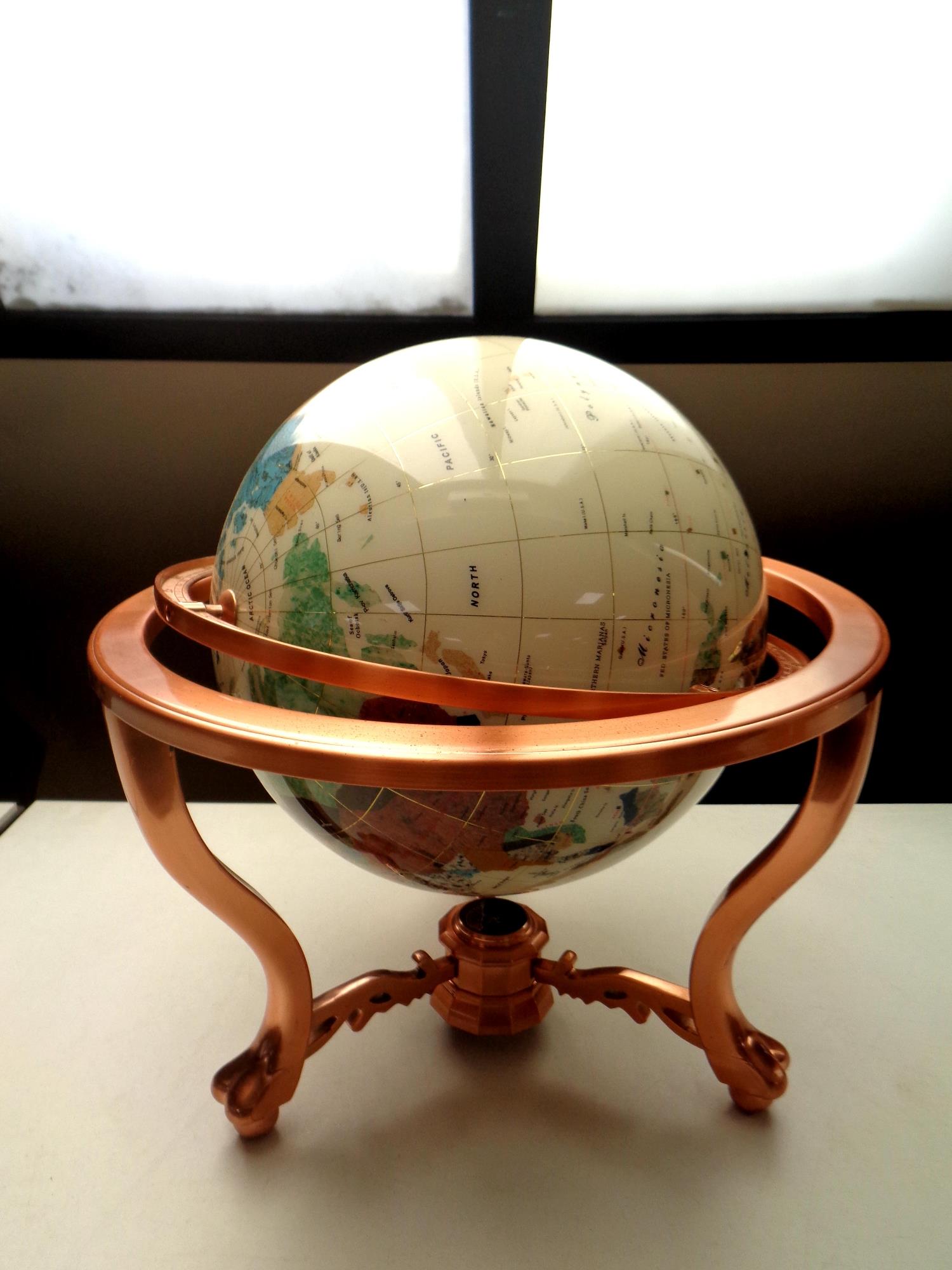 A gemstone globe on stand