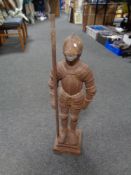 An antique cast iron figure of a knight