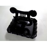 A cast iron boot scraper