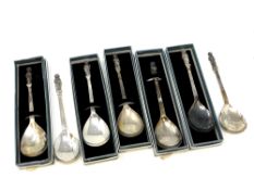 A collection of seven silver apostle spoons each showing a different saint (five boxed)