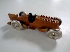 A cast iron vintage racking car with driver