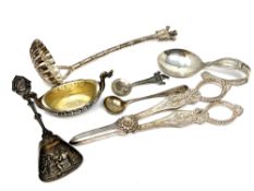 A group of silver and other items including caddy spoon, strainer, salt,