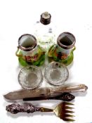 A cut glass silver rimmed perfume bottle together with a pair of cut glass silver rimmed salts,